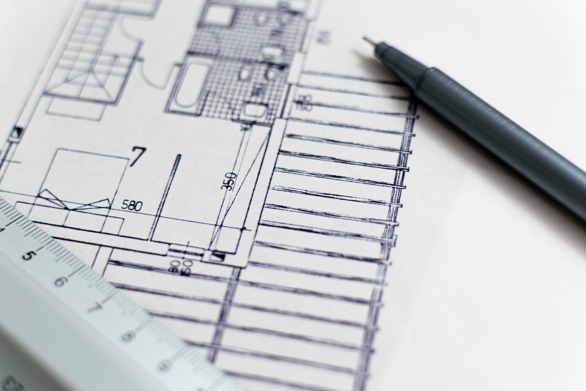 Architectural design with mechanical pencil on top